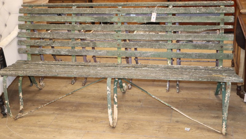 A Victorian slatted wrought iron garden bench, W.183cm, D.70cm, H.88cm